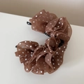 Close-up of elegant brown polka dot chiffon flower hair clip with French vintage style - Brown