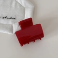 Glossy red rectangular mini hair claw clip for side hair styling on white fabric - Red