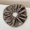 Detailed view of taupe satin scrunchie featuring black polka dots and metallic sheen - Coffee Polka Dot Glossy Satin - Double Layer Tie