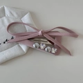 Detail of pink fabric bow hair clip with gray pearls and heart-shaped crystals - Pink Design Clip - Large Triangle