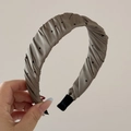 Detail of ruched taupe satin headband featuring black polka dots and soft texture - Coffee Polka Dot Glossy Satin - Pleated Headband