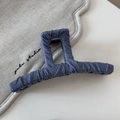 Detail of blue denim fabric texture and raw edges on a large rectangular hair claw clip - Denim Blue Fabric Wrapped Claw