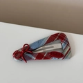 Detailed shot of red and blue plaid fabric BB hair clip with bow and star engraving - Red Blue Plaid - Red Bow Triangle BB Clip