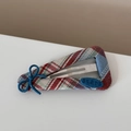Detailed shot of red blue plaid fabric hair clip with a bow and stars button detail - Red Blue Plaid - Blue Bow Triangle BB Clip