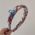 Detail of red and blue plaid fabric headband with blue bow and heart button - Red Blue Plaid - Blue Bow Headband