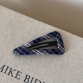 Close-up of a navy blue plaid fabric triangular hair clip with metal BB clip base - Hollow Triangle / Pink Blue Plaid Hollow Triangle Clip