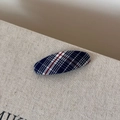 Close-up of navy blue and red plaid fabric texture on an oval BB hair clip for women - Pink Blue Plaid Oval Clip