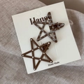 Close-up of two star-shaped hair clips with polka dots and checks on card packaging - Light Coffee