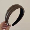 Close-up of brown PU leather headband with textured pleats and raised ridge detail - Brown