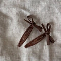 Detailed view of vintage bow hair clips with brown ribbed ribbons and high-quality metal finish - Coffee Bowknot Pair