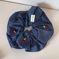 Detail of denim blue scrunchie with red cherry embroidery and white pearl accents - Hair Tie / Dark Blue
