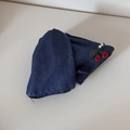 Detailed view of dark blue denim fabric with red cherry embroidery and white pearls - Triangle / Dark Blue