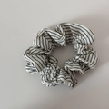 Detail shot of white scrunchie with black horizontal stripes and elastic cotton texture - White Striped