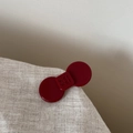 Detail of a dark red acetic acid flower bow hair clip on a textured beige fabric background - Small Bow Style / Red