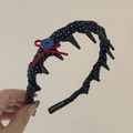 Close-up of navy plaid headband with red bow, blue button, and anti-slip teeth detail - Navy Blue Red Bow Polka Dot with Teeth
