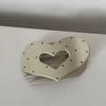Detailed view of heart-shaped cream hair claw clip with vintage black polka dot pattern - Heart Creamy White