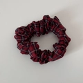 Detail of red Scottish plaid fabric scrunchie with elastic band and dense pleats - Red Plaid