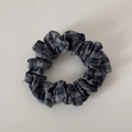 Detail of blue and grey checkered fabric scrunchie with soft ruffled texture - Grey Plaid