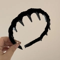 Close-up of black velvet wavy headband with inner comb teeth for secure hair grip - Black