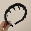 Detail view of black velvet wavy headband with inner teeth for secure non-slip hair styling - Gray