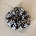 Detail shot of vintage plaid scrunchie with silver ribbons and elegant bow accents - Ballet Style Grey White Checkered