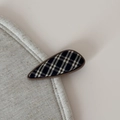 Close-up of geometric teardrop hair clip featuring classic British plaid fabric pattern - British Plaid Waterdrop Clip / Black