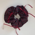 Detail view of red plaid scrunchie with silk ribbons and stylish checkered pattern fabric - Ballet Style Red Checkered