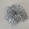 Macro detail of silver seersucker organza hair scrunchie with stripes and sparkles - Gray