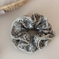 Detail of vintage black and white paisley fabric hair scrunchie with white overlock edges - White