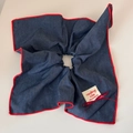 Detail of navy denim scrunchie with red scalloped edges and a fabric brand label - Navy Red Trim - Square Ring