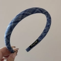 Close-up of blue denim plaid fabric headband with a small black and gold label - Classic Blue Plaid - Narrow Headband