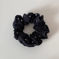Detailed close-up of dark denim hair scrunchie with white heart patterns and fine stitching - Black Denim Heart Polka Dot Small Scrunchie
