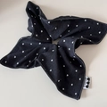 Detail of black denim hair scrunchie with white heart patterns and brand logo label - Black Denim Heart Polka Dot Square Scrunchie