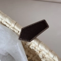 Detailed close-up of a brown textured fabric hair clip showing fine stitching on a woven base - Pentagon Shape / Brown
