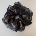 Detailed view of leopard print organza scrunchie with layered fabric and ruffled texture - Coffee Leopard Print Black Organza Scrunchie