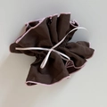 Detail of a brown pleated fabric scrunchie with pink edges and a white silk ribbon bow - Coffee Pink Ribbon Bow Cinched Loop