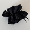Detail of black ruffled hair scrunchie with vintage black and white plaid ribbon accents - Black Ribbon Bow Cinched Loop