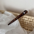 Detail of vintage leopard tortoiseshell hair clip on a textured beige surface - Dark Leopard Thin Straight
