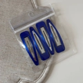 Detail view of 4 dark blue vintage hair clips in transparent PE self-sealing packaging - Vintage Blue