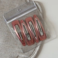 Close-up of four vintage pink marble BB hair clips in square and teardrop shapes - Vintage Light Pink