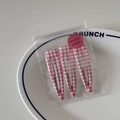 Dettaglio del set di clip per capelli BB a quadretti rosa in confezione trasparente - Stile Gingham Sottile Rosa