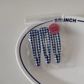 Detail view of three blue plaid BB hair clips on a white ceramic plate for girls - Blue Fine Gingham Style