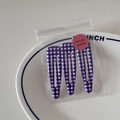 Close-up of three purple plaid BB hair clips in clear packaging on a white ceramic plate - Purple Fine Gingham Style
