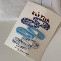 Detail showing 6-piece blue wave and floral print metal hair clips on display card - Dark Blue