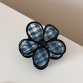 Macro shot of minimalist deep blue plaid flower hair claw clip with elegant resin texture - Five-petal Flower Style / Dark Blue Plaid