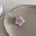 Detail of floral acetate hair claw with purple marbled texture and center rhinestone - Light Pink