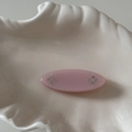 Detail of pink resin hair clip with small rhinestones on a decorative shell plate - Pink