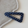 Close-up of blue and black checkerboard pattern fabric on a metal BB hair clip - Plaid Triangle BB-Blue Black