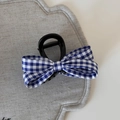 Detailed close-up of blue and white plaid bow hair claw clip with a glossy black resin base - Blue Plaid - Medium Claw
