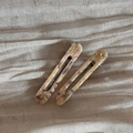 Detail of acetate marble pattern hair clips with France Handmade text on cream fabric - Hollow Out Clip Pair / Off-white